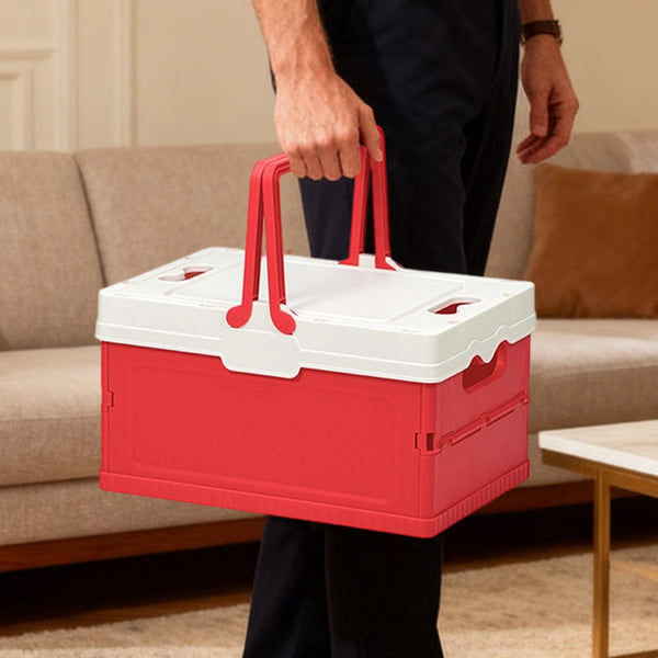 Person holding a Foldable Plastic Camping Storage Box with red and white design, perfect for organizing and storage.