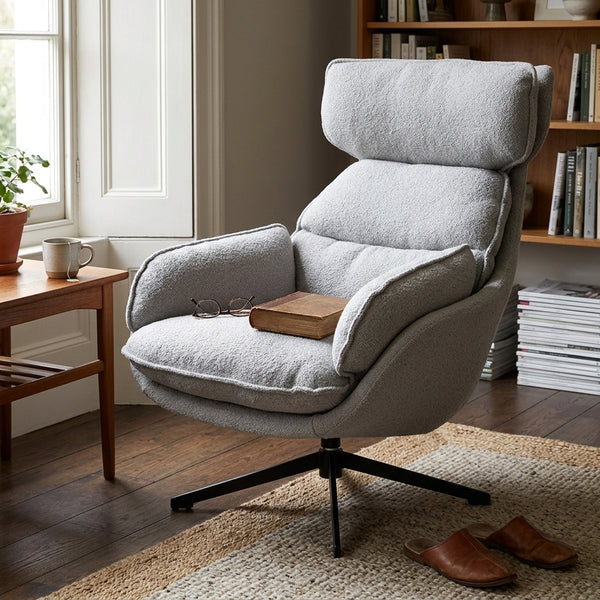 Lamach Lounge Chair in gray fabric with high-back support, placed in a cozy living room setting.