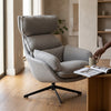 Lamach Lounge Chair in a modern living room, offering comfort with a soft gray fabric and high-back support.
