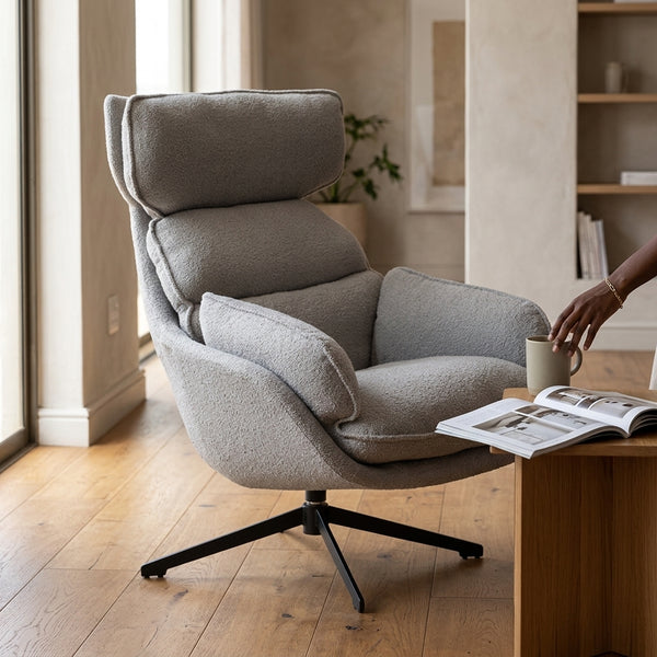 Lamach Lounge Chair in a modern living room, offering comfort with a soft gray fabric and high-back support.