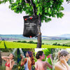 20L Outdoors Portable Water Shower Bag hanging on a tree for outdoor showering convenience in nature.