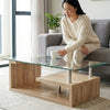 Woman enjoying a drink at a Tempered Glass Top Coffee Table with Oak Base in a modern living room setting.