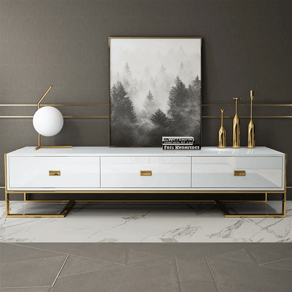 Urban Modern Media Console with a sleek white finish and gold accents, styled with decorative elements.