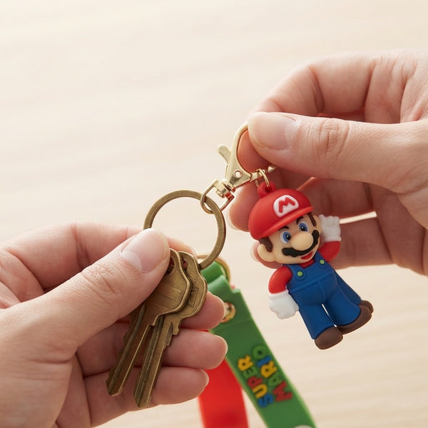 3D Plumber Silicone Keychain held by hands with keys, showcasing a playful plumber design.