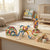 Colorful structures built with the 29-Piece Flexible Magnetic Building Rod Set on a wooden table.