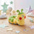Caterpillar Plush Throw Pillow in a playful setting with colorful stars and clouds, perfect for kids' decor.
