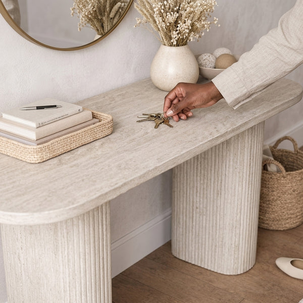 Modern Fluted Pedestal Console Table with keys and decor in a stylish entryway setup