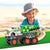 Child playing with a Friction Powered Eco City Garbage Truck at the beach, promoting imaginative and eco-friendly fun.