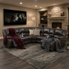 Wembley Luxury Recliner Sectional Couch in a cozy living room with a fireplace and plush blankets.