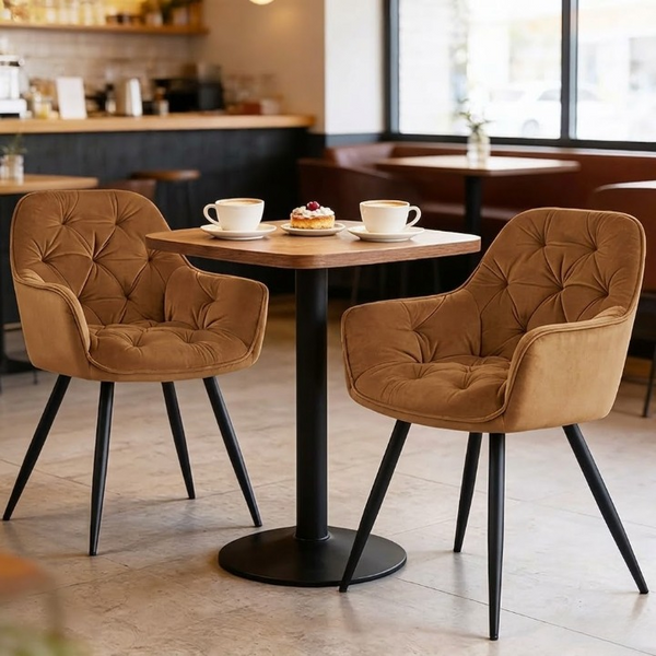 Senna Velvet Padded Dining Chair set at a cafe table with coffee and dessert, showcasing modern elegance and comfort.