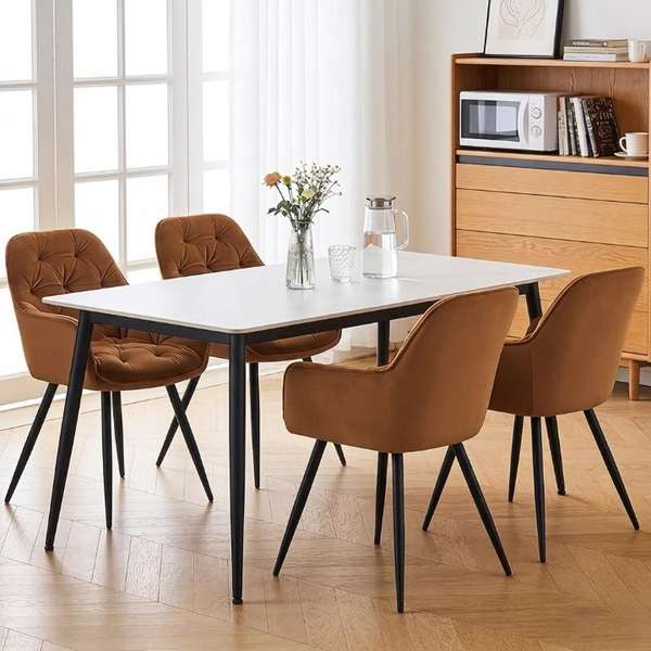 Senna Velvet Padded Dining Chair at a modern dining table with floral centerpiece and stylish decor.