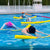 Swimmers using Small Pool Noodle in a pool for support during practice and water exercises.