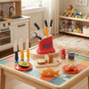 Happy Little Chef Kitchen Helper Playset for Kids with toy knives, plates, and food items on a colorful table.