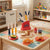 Happy Little Chef Kitchen Helper Playset for Kids with toy knives, plates, and food items on a colorful table.