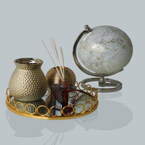 American Round Loop Mirror Tray Gold - Large with decorative items and globe.