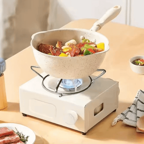 Compact Outdoor Gas Camping Stove cooking delicious meals with fresh vegetables and meat in a portable setup.
