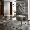 Mirren Luxury Marble Dining Table showcased in a modern dining area with sleek metallic legs and a polished marble surface.