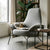 Zen Lounge Chair with cozy blanket and coffee cup in a serene living space.
