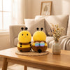 8-Inch Faux Mink Bee Plush Toy, a pair of cute yellow bee plushies on a table with flowers in a cozy room.
