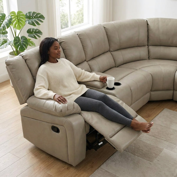 Woman relaxing on Wembley Luxury Recliner Sectional Couch with a drink in hand, showcasing its recline feature.