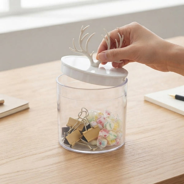 Person opening the Antler Desktop Storage Box with decorative antlers, revealing small office supplies inside.