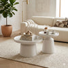 Modern White Round Coffee Table Set showcased in a stylish lounge with decorative items and seating.