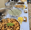 Deliciously arranged food in round chafing dishes showcasing various dishes at a buffet, highlighting the 4L Round Chafing Dish with Glass Lid.