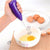 Coffee Milk Whisk Cappuccino Frother in use, frothing eggs in a bowl with a purple handheld electric whisk.