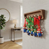 3D Plumber Silicone Keychain displayed on a wall key holder, featuring colorful plumber designs in a playful arrangement.