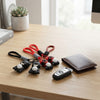 Colorful Silicone Superhero Keychains on a desk next to a wallet and car key, adding playful character to everyday items.
