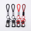 Silicone Superhero Keychain collection featuring playful character designs in black and red.