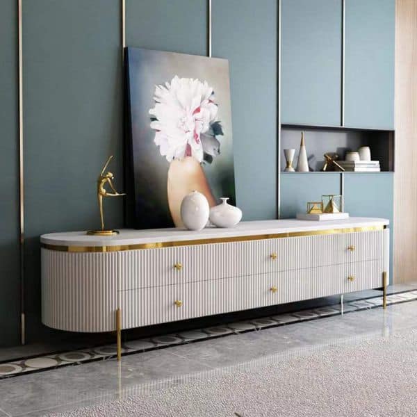Storage TV Stand featuring a sleek design with drawers, decorative accessories, and a stylish painting above it.