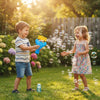 Children playing with the Handheld Bubble Blaster Set, creating bubbles in a sunny garden.