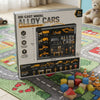 Die-Cast Model Alloy Cars Construction Vehicle Gift Set packaging on a colorful rug with toys.