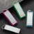 Mini Portable LED Keychain Flashlight variety of colors including pink, green, blue, and black on a dark surface.