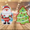 Festive Christmas Serving Trays 36x25cm featuring Santa and Christmas tree designs on a wooden table.