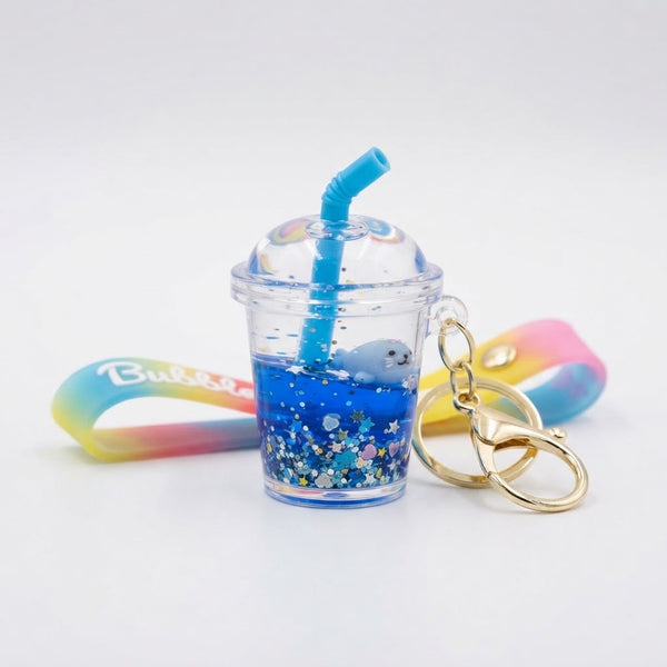 Floating Liquid Bubble Tea Cup Keychain with blue liquid and playful design, perfect for bags and keys.