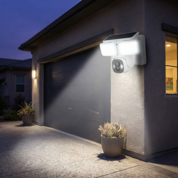 Solar Wall Light PTZ Camera illuminating outdoor space at night on a garage wall.