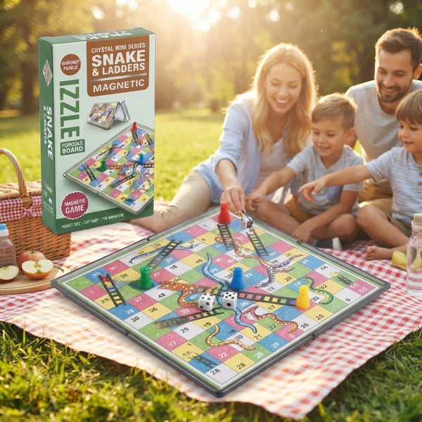 Family enjoying the Mini Magnetic Snakes & Ladders Board Game on a picnic blanket outdoors.