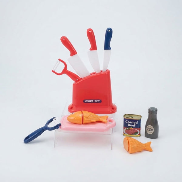 Kitchen Helper Happy Little Chef Pretend Play knife set with colorful toy knives and food items.
