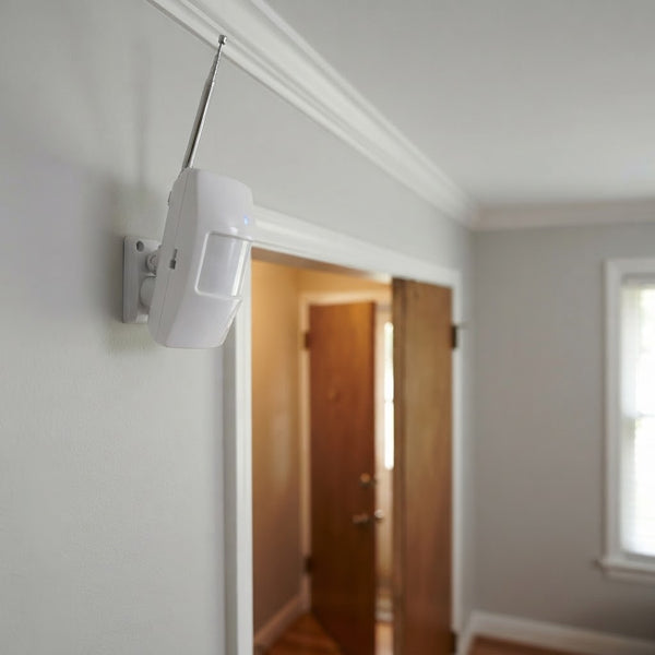 433MHz Wireless PIR Motion Detector Unit mounted on a wall, providing security for entryway.
