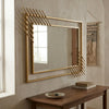 Modern Geometric Decorative Wall Mirror with a striking gold frame and unique multi-paneled design.