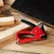 GS Manual Nail Staple Gun on a wooden surface with wooden blocks for DIY and repairs