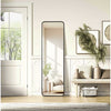Full Length Leaner Floor Mirror leaning against a wall in a bright, modern interior with decorative plants and stylish furniture.