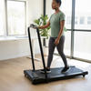 Woman exercising on the Cross-Border Electric Home Treadmill with LED Display in a bright home environment.