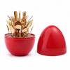 Gold Flatware Set — 24-Piece Stainless Steel Cutlery Collection displayed in a red egg-shaped container.