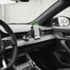360-degree rotating multifunction car phone holder securely holding a smartphone on the dashboard for easy navigation while driving.