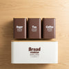 4-Piece Metal Bread Box Set with sugar, tea, and coffee canisters for organized kitchen storage.
