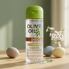 Professional Olive Oil Glossing Hair Polisher bottle on a table with flowers and decorative eggs.