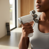 A woman holding a 3-Head Body Massager, ready to relieve muscle tension and aches with interchangeable massage heads.